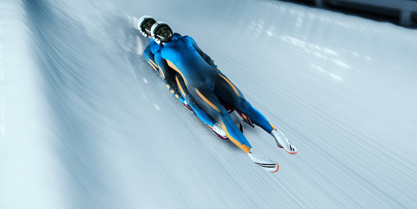 Male Lugers Couple glides on the sleigh in professional Luge Track on competition. Sportsman dressed in a suit for sledge sports and protective helmet