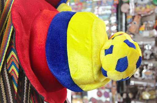 Special souvenir for the Soccer World Cup. This hat has the colors of the Colombia's flag, and a soccer ball on top of it.