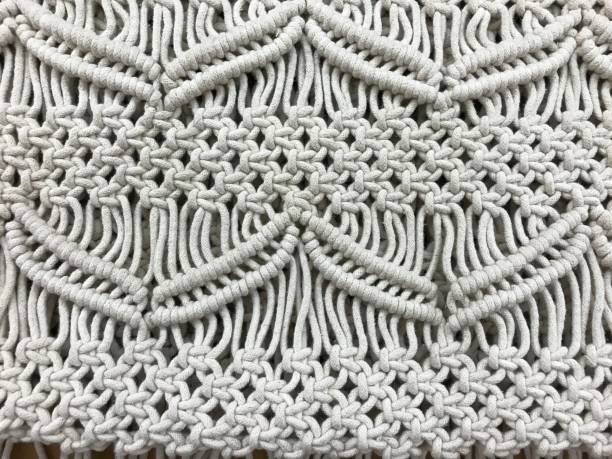 Macrame Close up of hand knotted macrame worked in heavy cord. macrame photos stock pictures, royalty-free photos & images