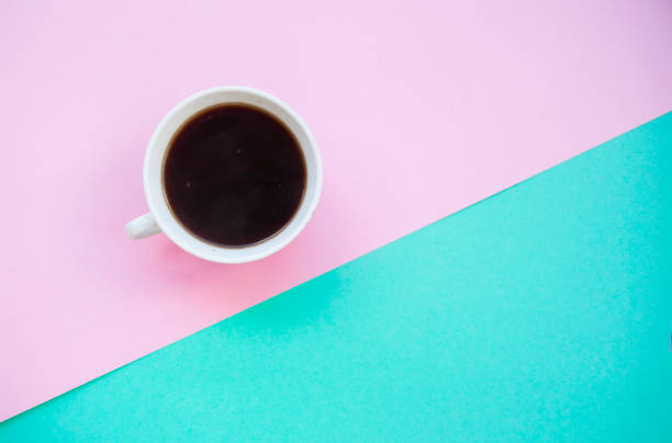 istock A cup of coffee on colorful background. 976716340