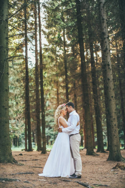 istock Bride and groom in romantic forest 976731496