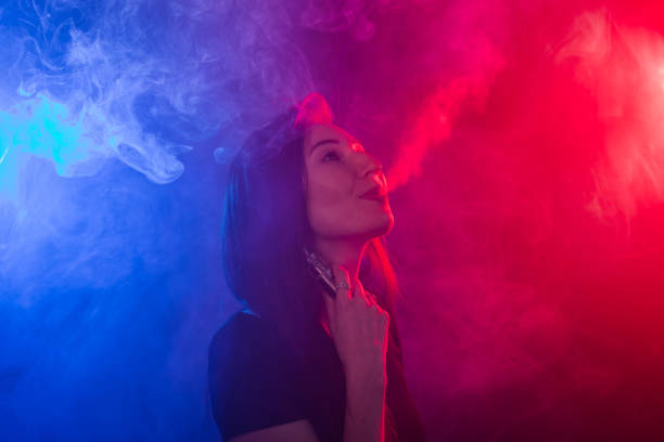 istock young woman smoking electronic cigarette 976733868