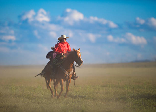 istock Cowboys Horseback Riding 976734202