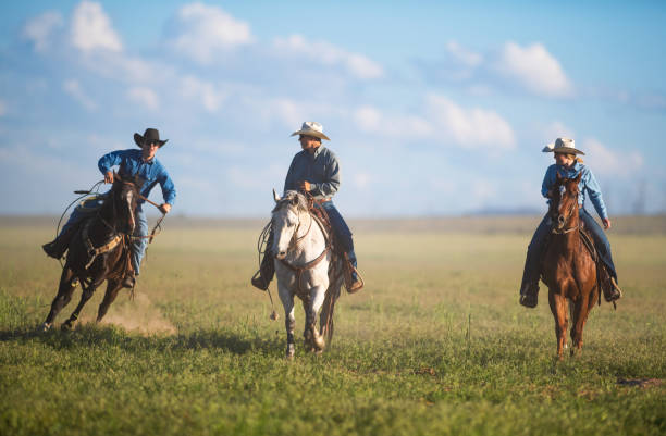 istock Cowboys Horseback Riding 976734372