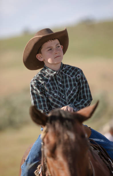 istock Little boy horseback riding 976734688