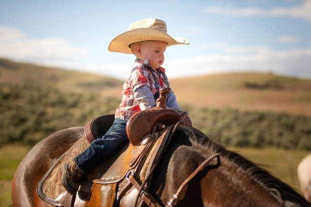 istock Little boy horseback riding 976735046