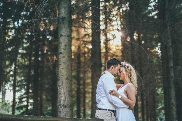 Bride and groom in romantic forest