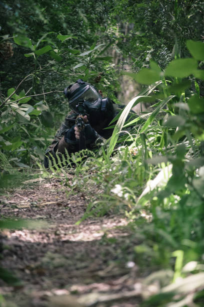 istock Airsoft soldier in the woods 976743260