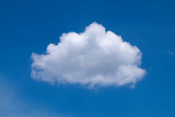one nice cloud on the blue sky background - um único objeto imagens e fotografias de stock