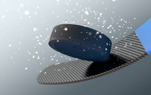 An extreme closeup slow motion action capture of a ice hockey puck striking a hockey stick with ice particles emanating on a dark isolated background - 3D render\