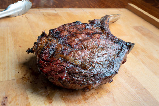 istock Cooked Rib Eye Beef Steak on a Cutting Board 976754816