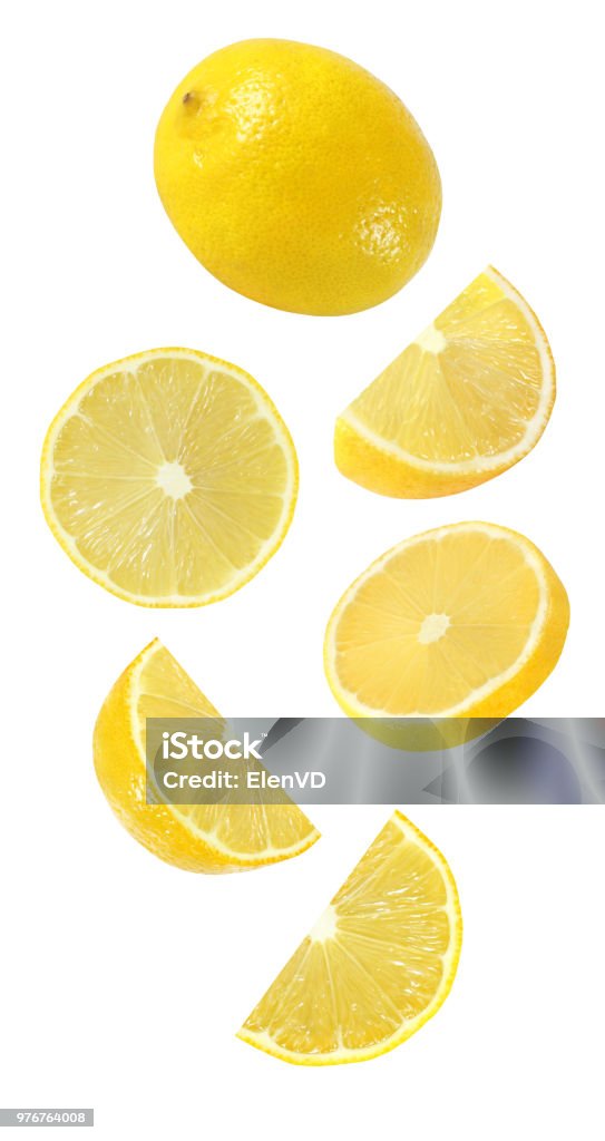 falling, hanging, flying whole and half piece of lemon fruits isolated on white background with clipping path Lemon - Fruit Stock Photo