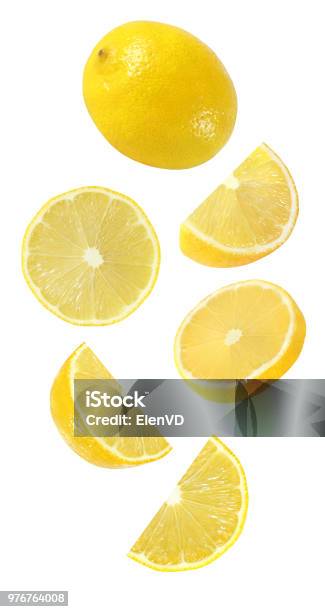 Falling Hanging Flying Whole And Half Piece Of Lemon Fruits Isolated On White Background With Clipping Path Stock Photo - Download Image Now