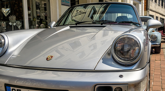 Wolfsburg, Lower Saxony, Germany, May 27, 2018: Front view of a silver-grey Porsche Carrera at a vintage car meeting, Fallersleben