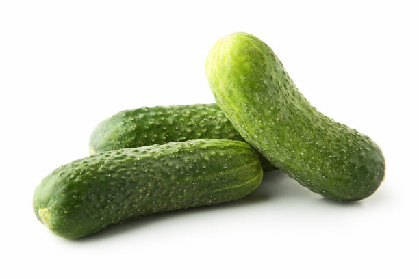 istock Fresh cucumbers isolated on white background 976783646
