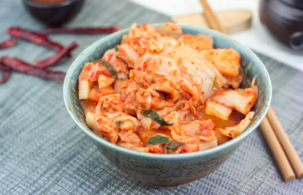 istock Kimchi cabbage. Korean appetizer in ceramic bowl, horizontal 976789738