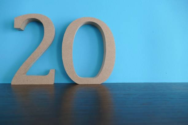 istock Number 20 in wooden numbers on blue background 976792376