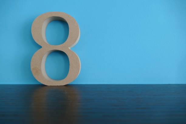 Number 8 in wooden numbers on blue background