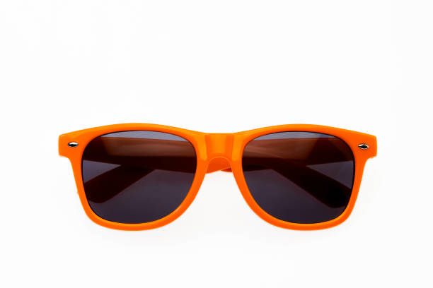 orange sonnenbrille auf weißem hintergrund - isolated on white photography horizontal color image stock-fotos und bilder