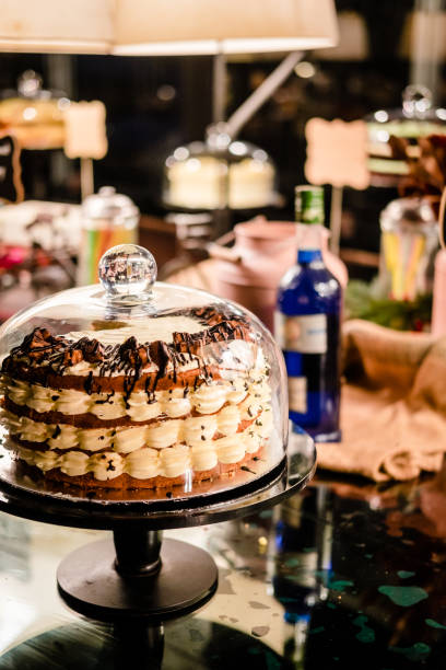 istock Tiramisu layer cake under glass bell dome 976796108