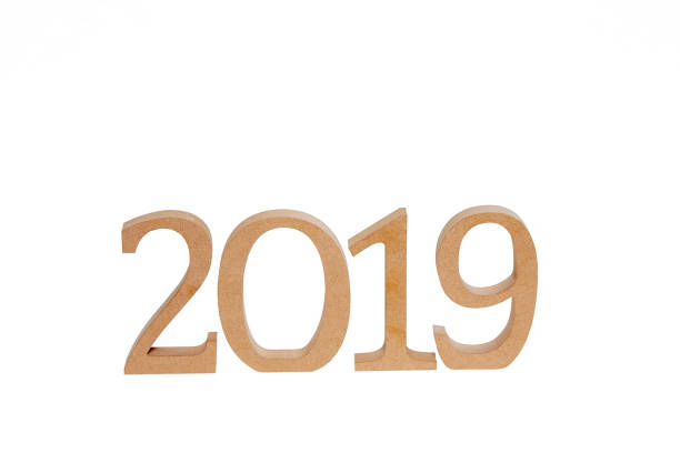 istock Year 2019 in wooden numbers on white background 976797388