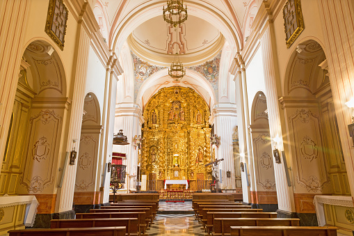 Cordoba - The nave of church of Monastery of st. Ann and st.Joseph (Convento de Santa Ana y San Jose) with the main altar by Sanchez de Rueda (1710).
