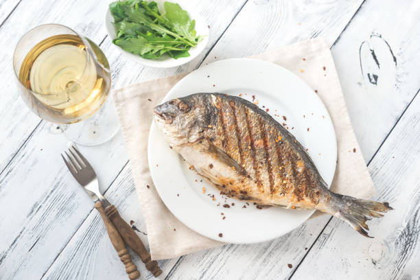 istock Grilled gilt-head bream on the plate 976800134
