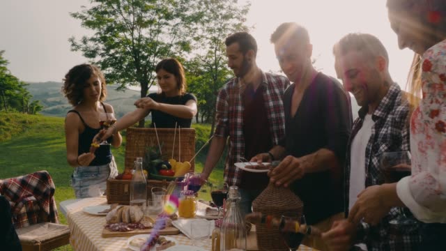 Friends making an aperitif during a barbecue