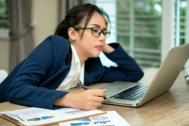 istock Stressed business woman working on a laptop 976802108