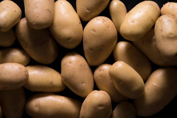potatoes on black background