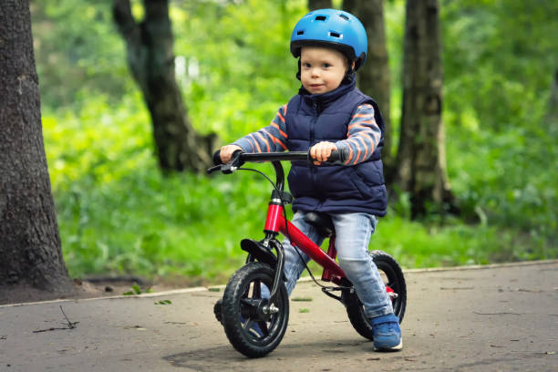 istock A boy riding runbike in a park 976805980