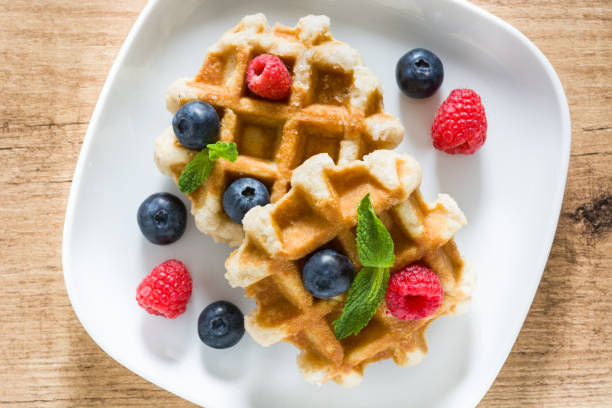 istock Traditional belgian waffles with blueberries and raspberries 976813040