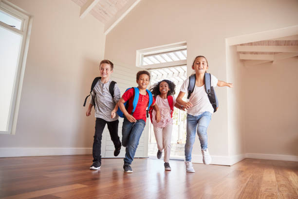 istock Group Of Children Returning Home After School Day 976829332