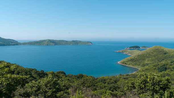 Beautiful blue water bay, crystal clean water, blue sky Beautiful blue water bay, crystal clean water falmouth harbor stock pictures, royalty-free photos & images