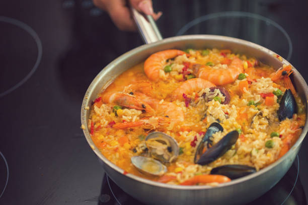 istock Young Woman Cooking at Home 976859360
