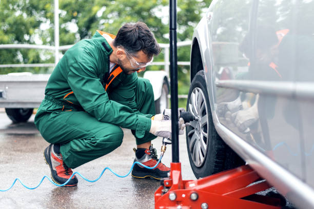 istock Tire changing at car service 976867350