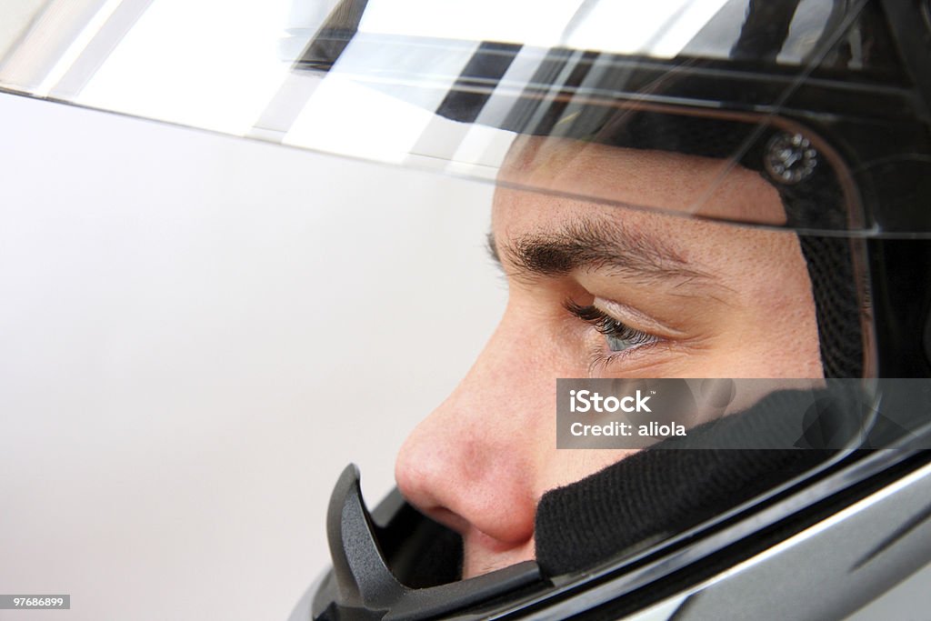 Uomo in Casco da motociclista - Foto stock royalty-free di Elmetto