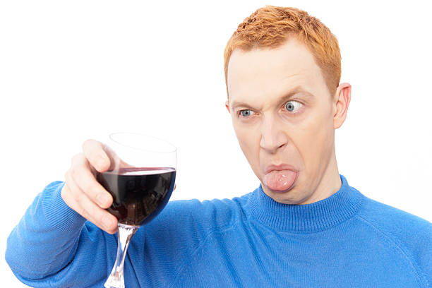 istock young cute guy with red hair hates wine 97687834