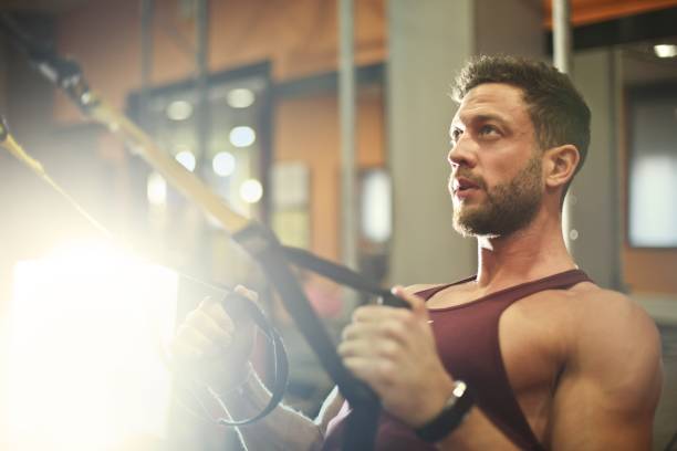 istock Man training at the gym 976887042