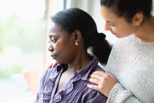 istock Psychotherapy:  Mental health professional consoling patient 976894152