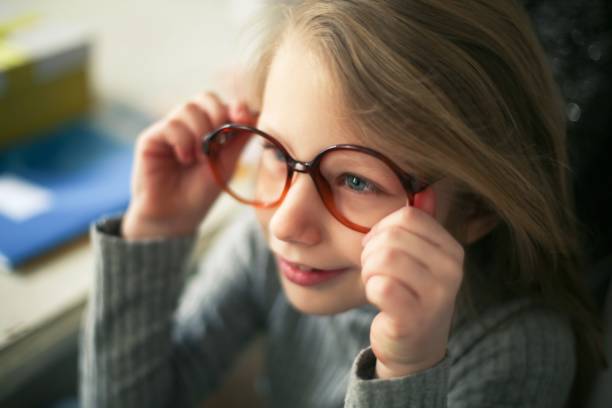 istock Girl with big glasses 976895680