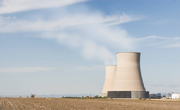 istock Nuclear power station with steaming cooling towers 97689864