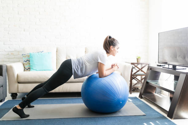 istock Woman doing pilates workout at home 976899014