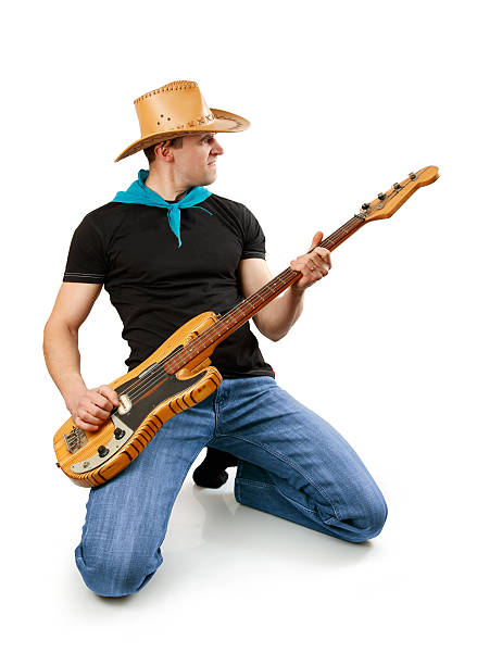 istock young man with bass guitar 97690258