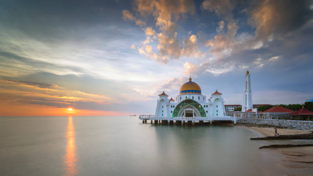 istock Clear reflections during sunrise at Straits Mosque, Malacca. Nature composition. 976933060