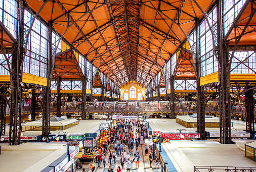 HUNGARY, BUDAPEST - MAY 19, 2018: Interior of the famous Great Market hall crowded with people, this building is largest and oldest indoor market in Budapest, Hungary