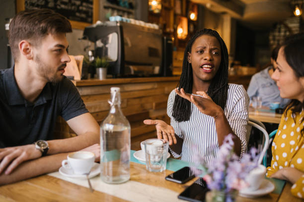 istock Friends talking at the coffee shop 976966534