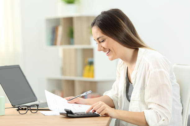 Happy woman doing domestic accounting