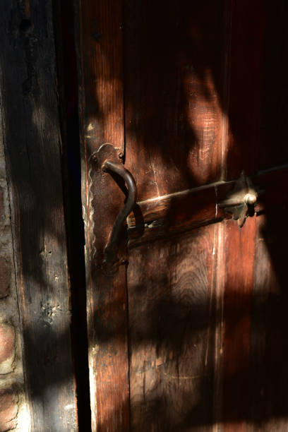 istock vintage wood open door interior with antique handle 976991270