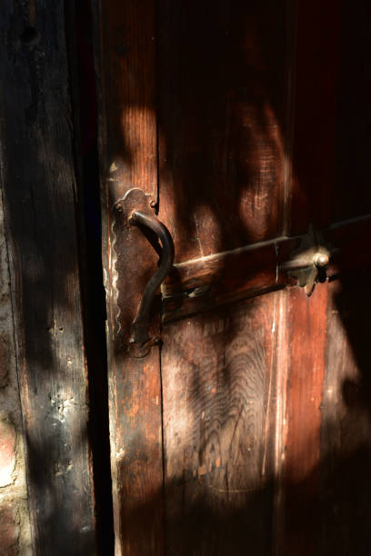 istock vintage wood open door interior with antique handle 976991356
